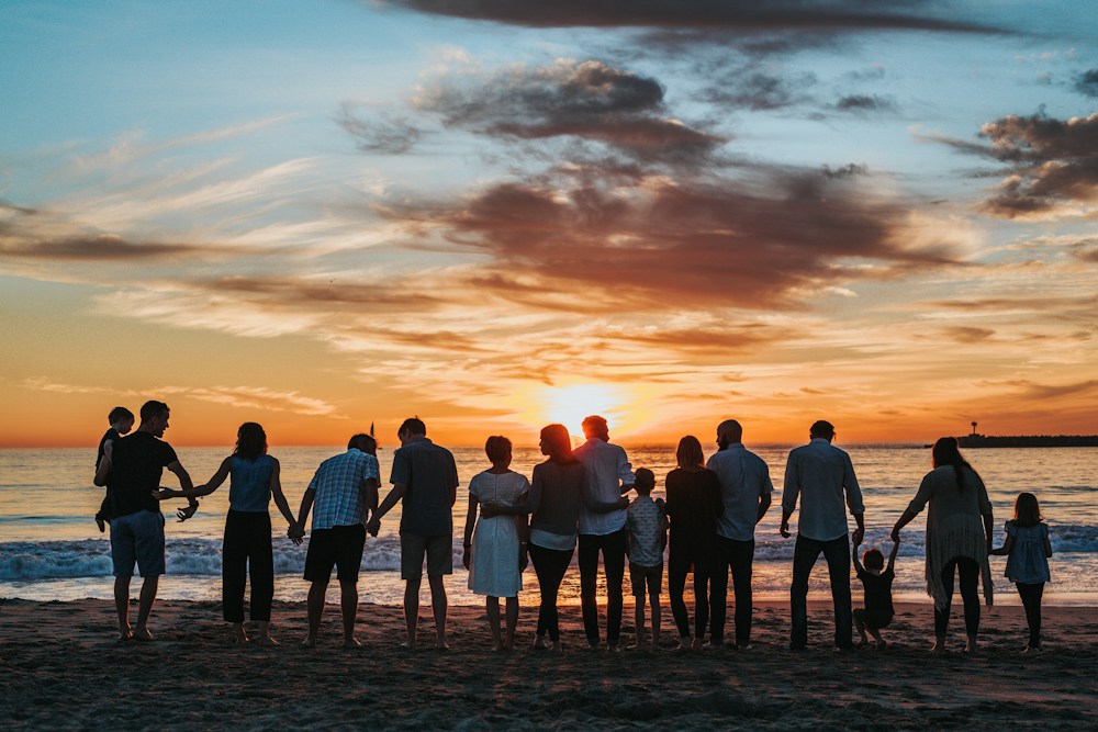 A family sharing a moment together at sunset
